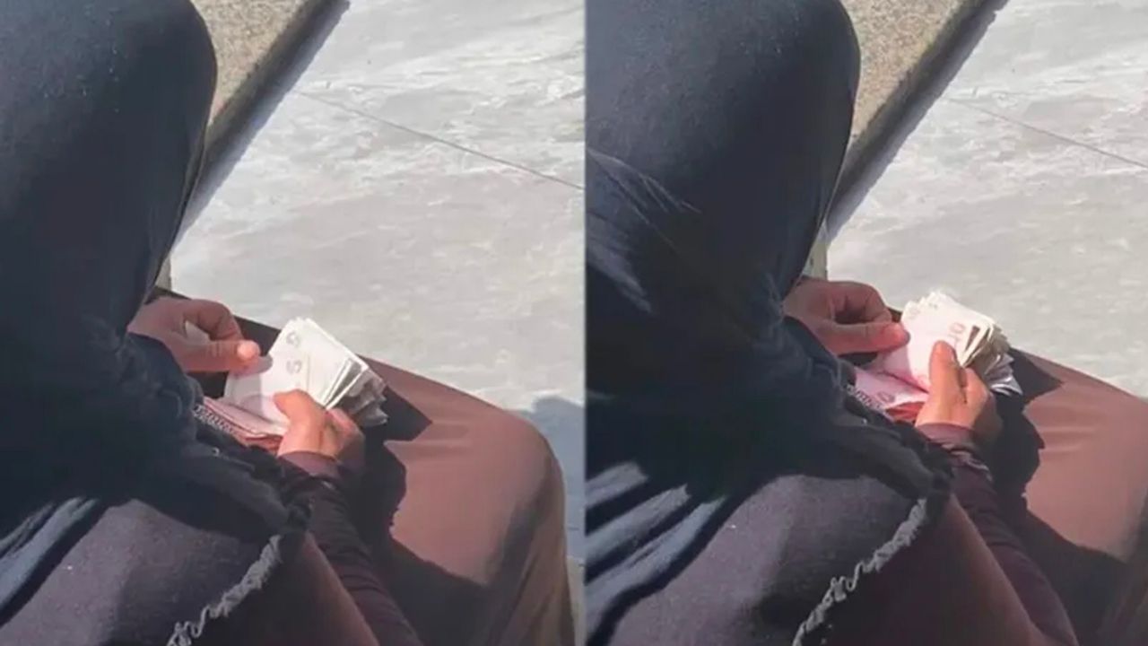 Taksim'de hasılatını sayan dilenci kadın kamerada