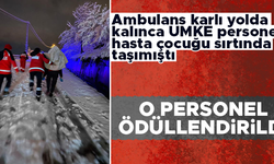 Trabzon'da hasta çocuğu karlı yolda sırtında taşıyan hemşireye ödül