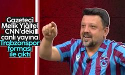 Gazeteci Melik Yiğitel, CNN Türk'teki programa Trabzonspor forması ve kasketiyle çıktı